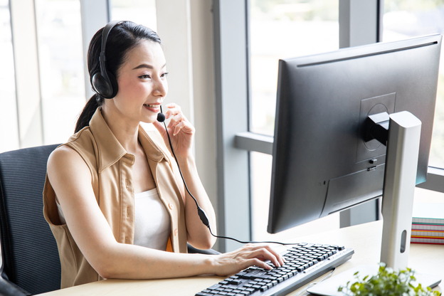 call-center-woman-advising-customers-calling-W58VGAV-1